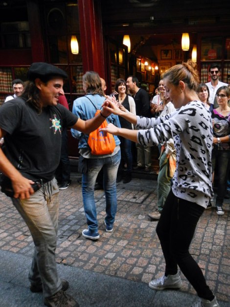 A family dancing at the Bilbao street party on the 'Dia de Fiesta Nacional'