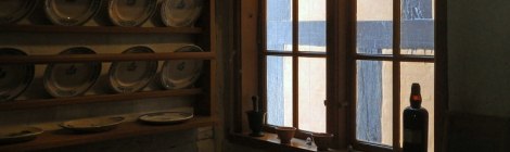 A single window as a light source in an 1872 kitchen in Den Gamle By, a recreated village in Aarhus, Denmark